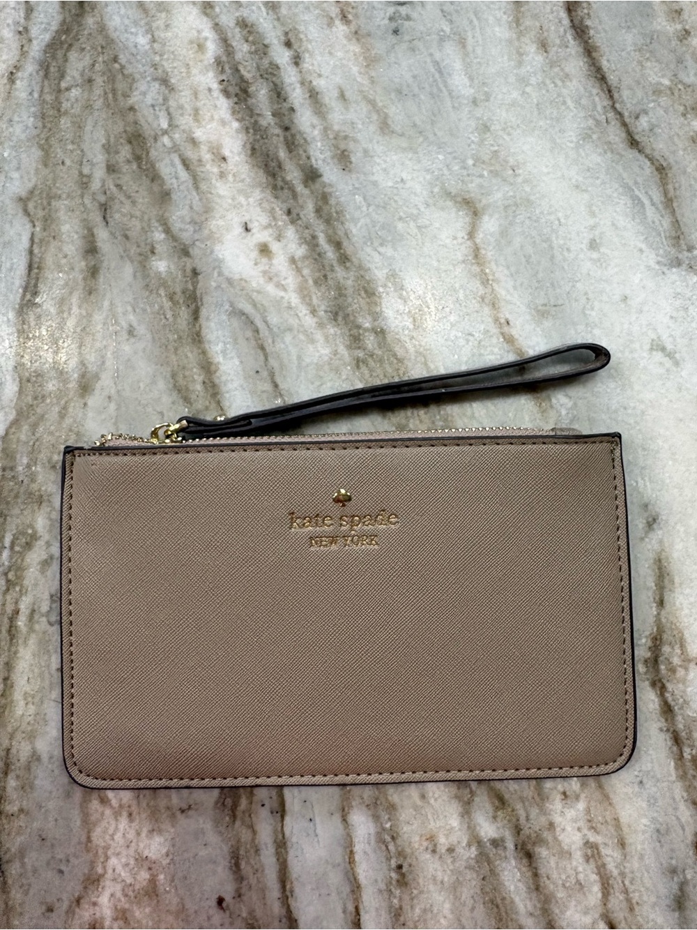 kate spade taupe leather wristlet with gold logo